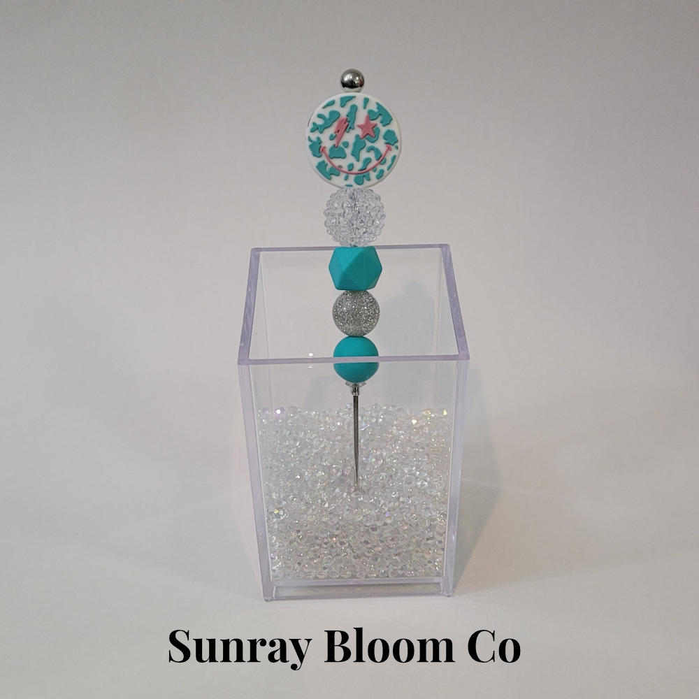 Turquoise Smiley Face Pokey Weeding Tool