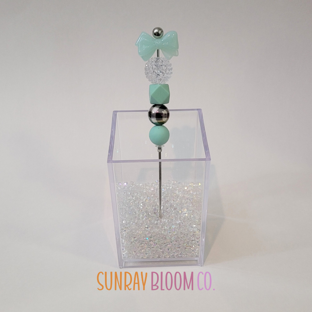 Turquoise Bow Pokey Weeding Tool