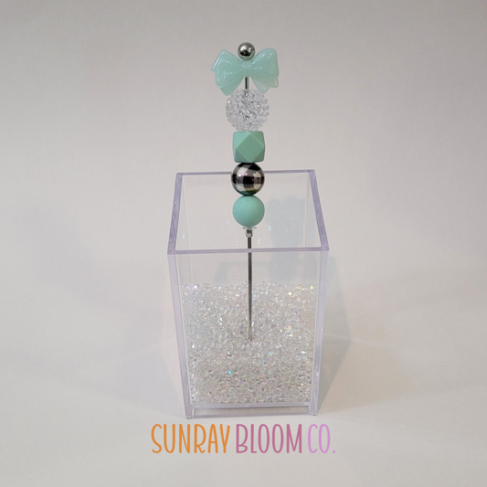 Turquoise Bow Pokey Weeding Tool