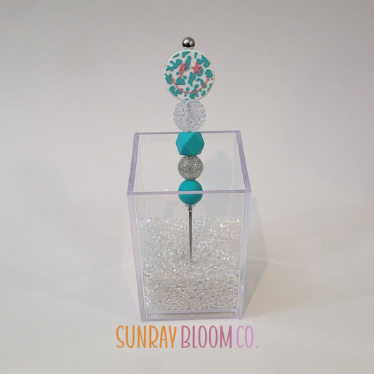 Turquoise Smiley Face Pokey Weeding Tool