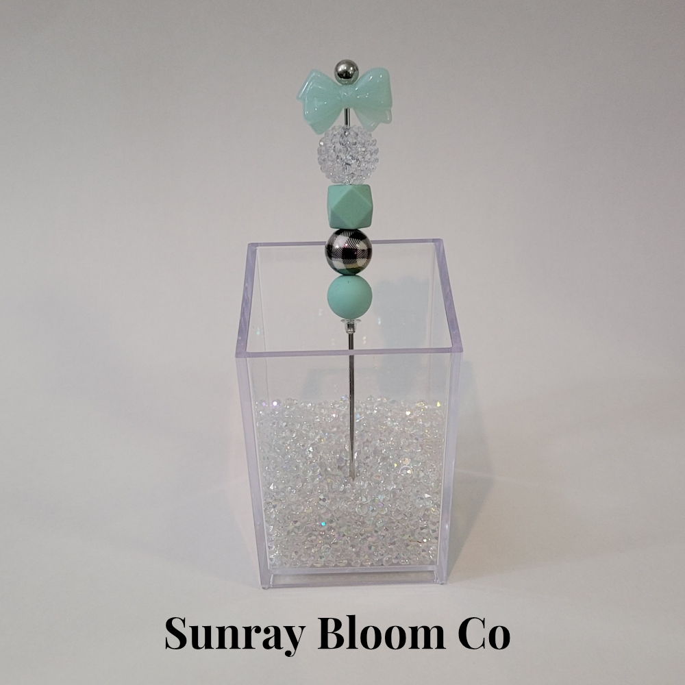 Turquoise Bow Pokey Weeding Tool