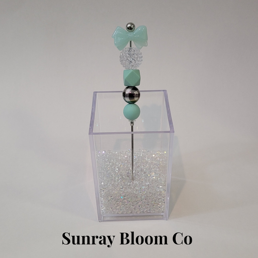 Turquoise Bow Pokey Weeding Tool